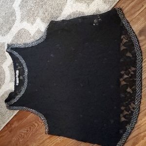 Lace top, see through, with embellishments around neck, bottom, and arms